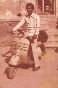 Picture of N.K. Chaudhary on a moped