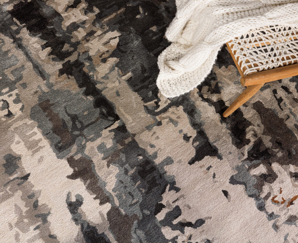 A black, white, and gray abstract rug
